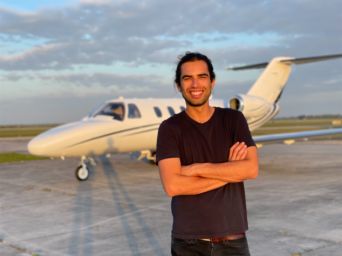 DAJETS founder Max on the ramp in front of a Citation CJ